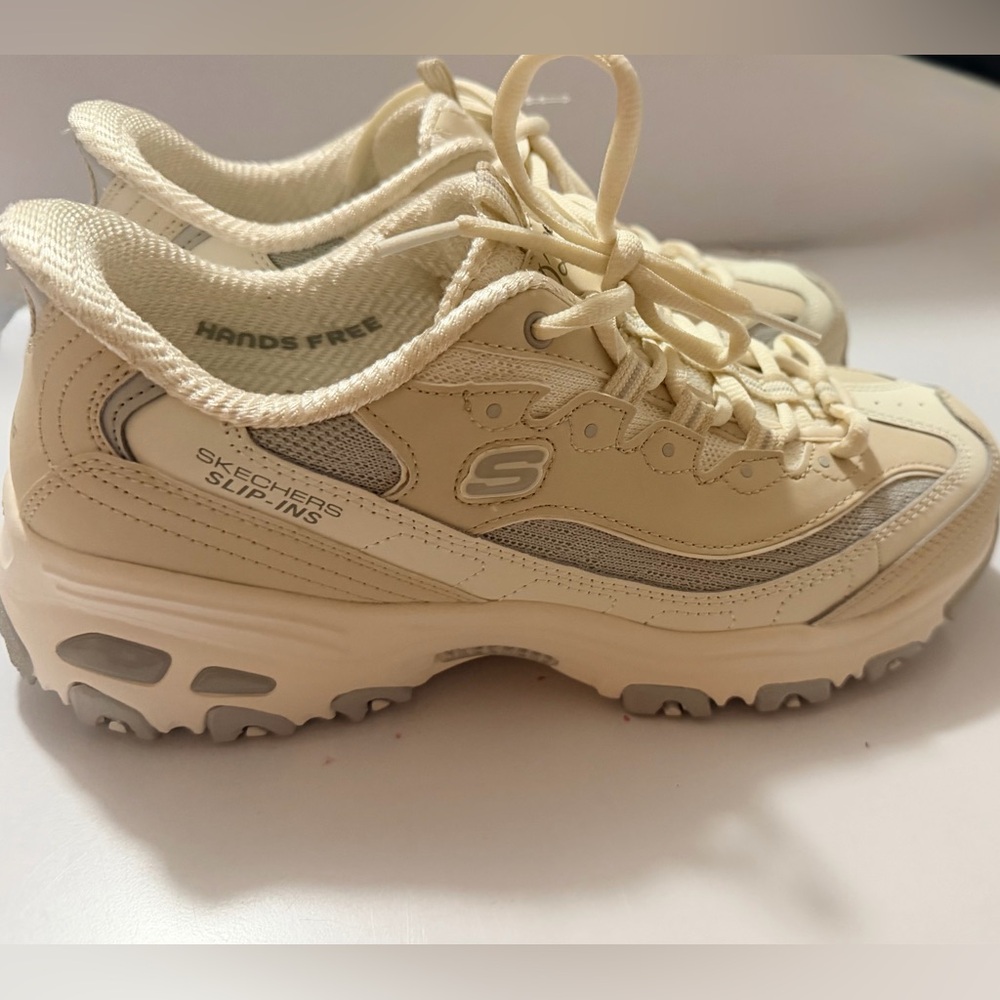 They are brand New ,without tags/ Skechers Women's Cream/Tan Slip-Ins Sneakers